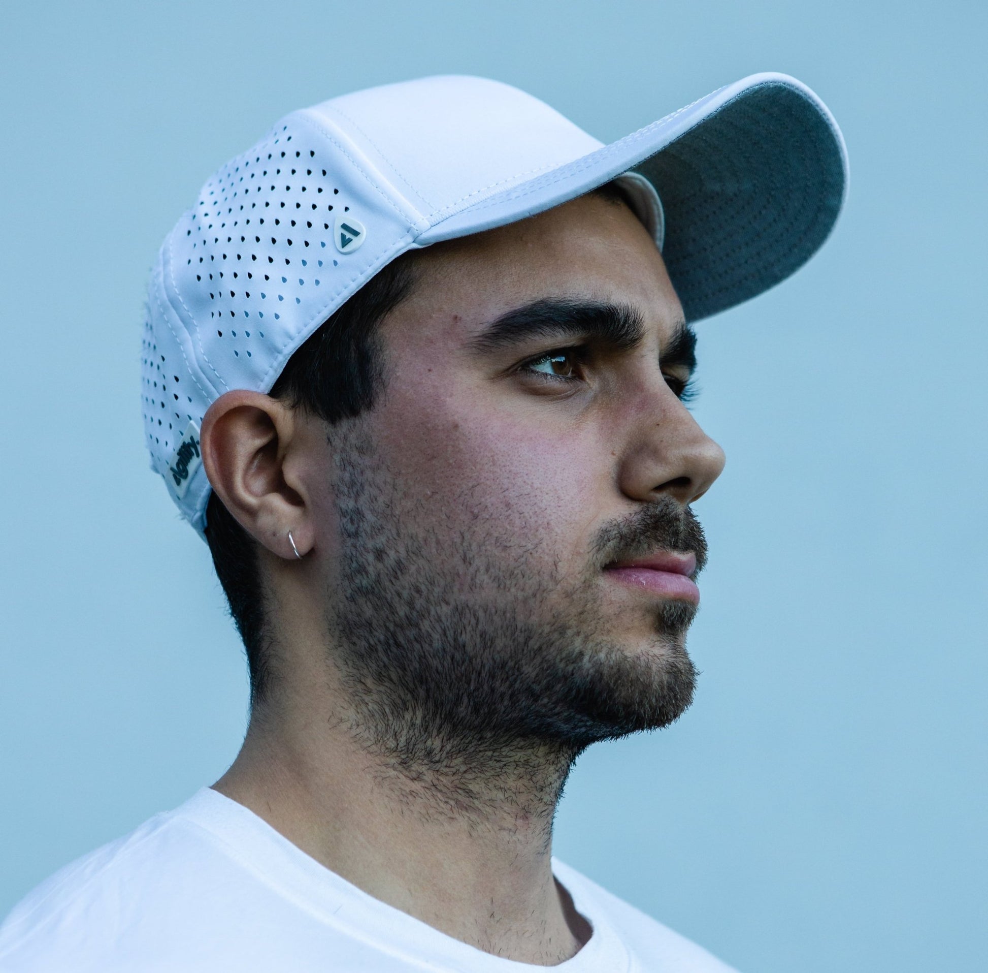 White Pursue Performance Cap worn view - athletic training cap for running and endurance sports
